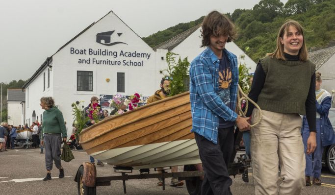 Boat Building Academy’s largest female cohort launch their boats in Lyme Regis